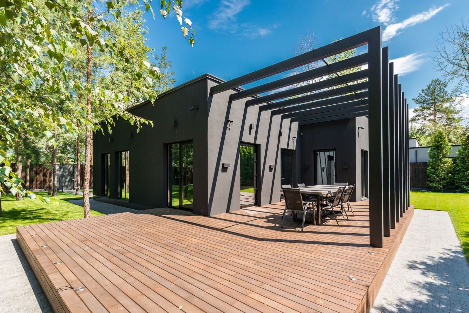Outdoor living area with timber decking and a shade structure