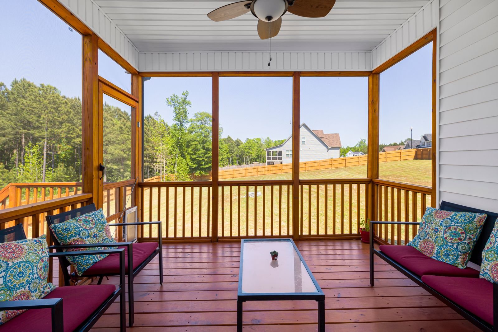Screened porch enclosure with cushioned seating