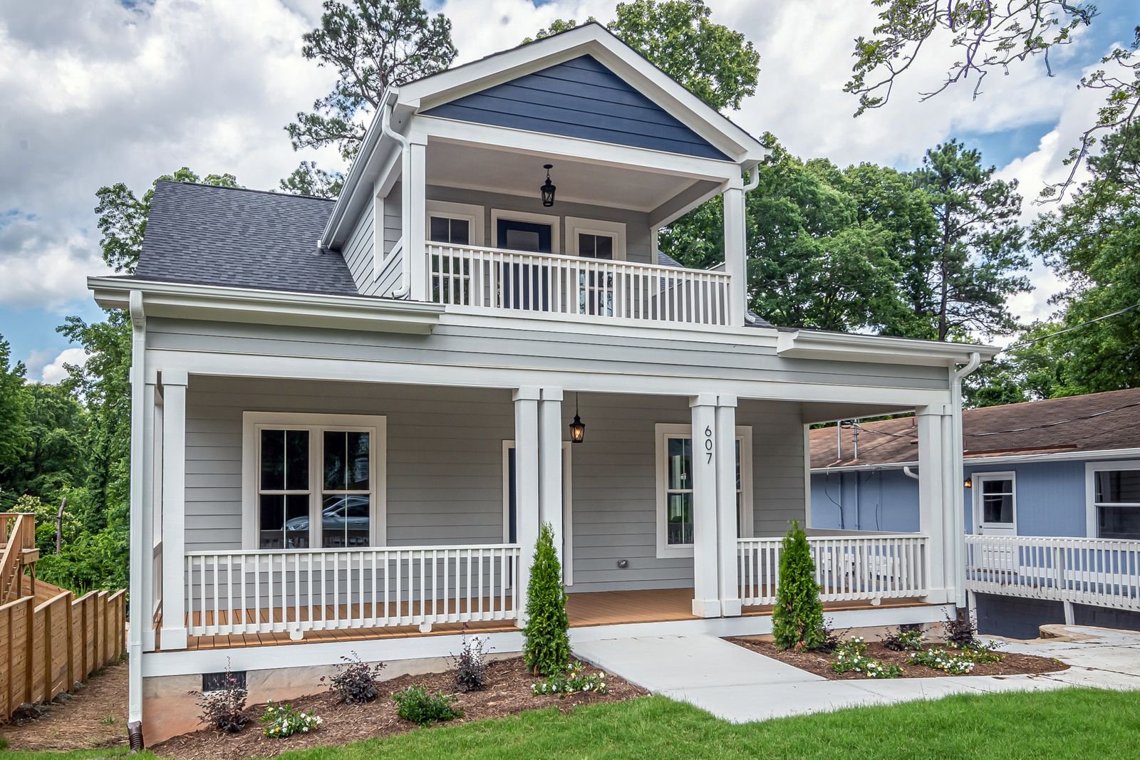 Two-storey house with a front porch and covered entry